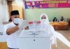 Pilkada Serentak, Nanang dan Istri Nyoblos di TPS 01 Desa Way Galih